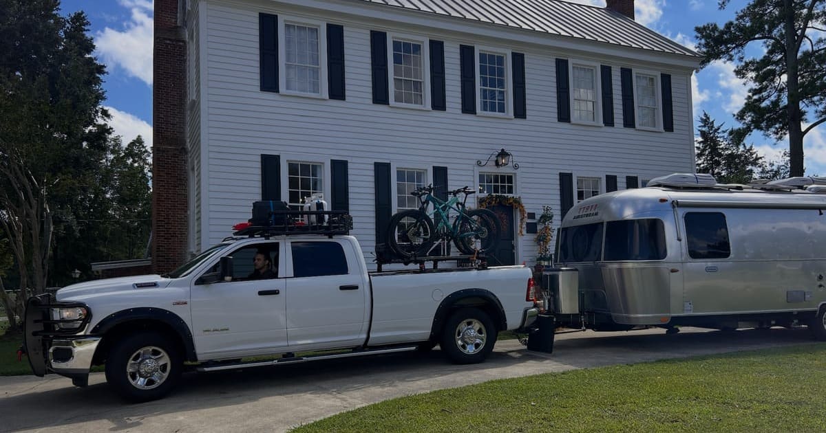 Airstream RV parked beside the historic Scarborough House, a Harvest Hosts wedding venue in Stantonsburg NC