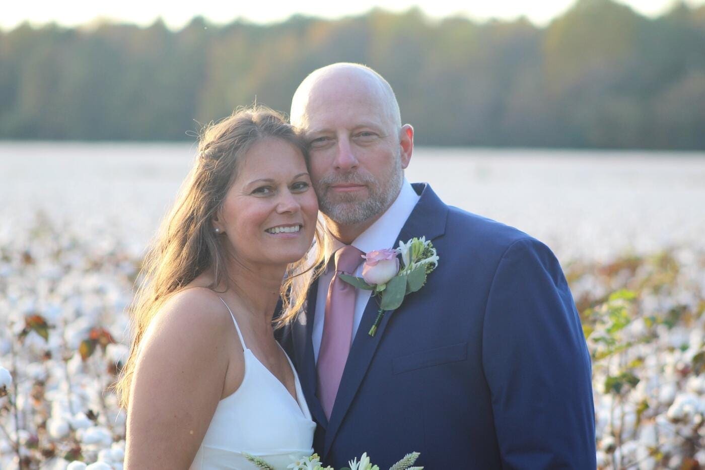 Couple walking together through the open grounds at Scarborough House, a wedding venue with lodging near Raleigh, NC