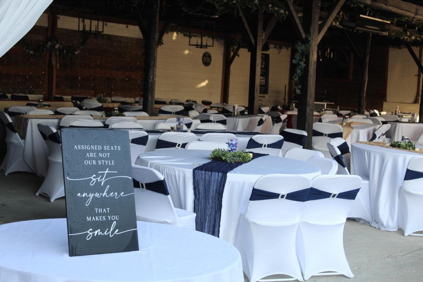 Reception tables set and ready for guests inside the heated and cooled pavilion at Scarborough House in Stantonsburg, NC