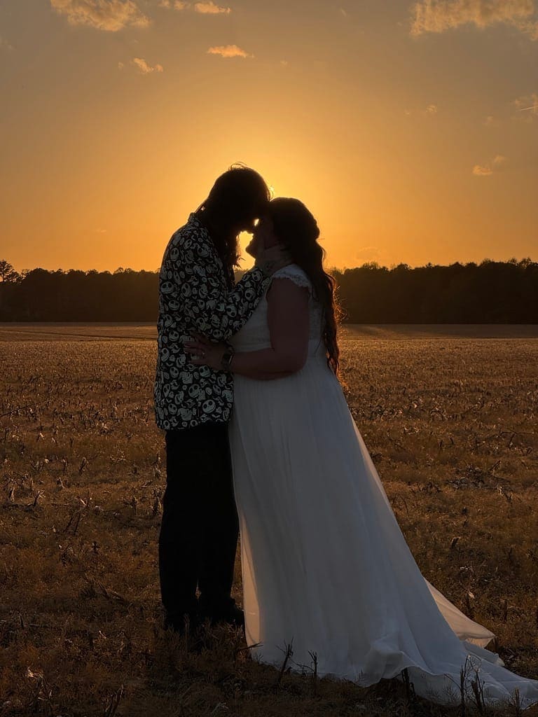 Couple in a golden field at sunset at Scarborough House
