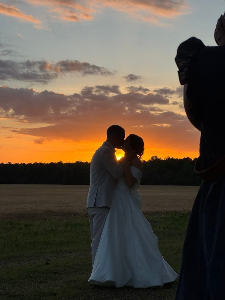 Silhouette of couple kissing at sunset at Scarborough House