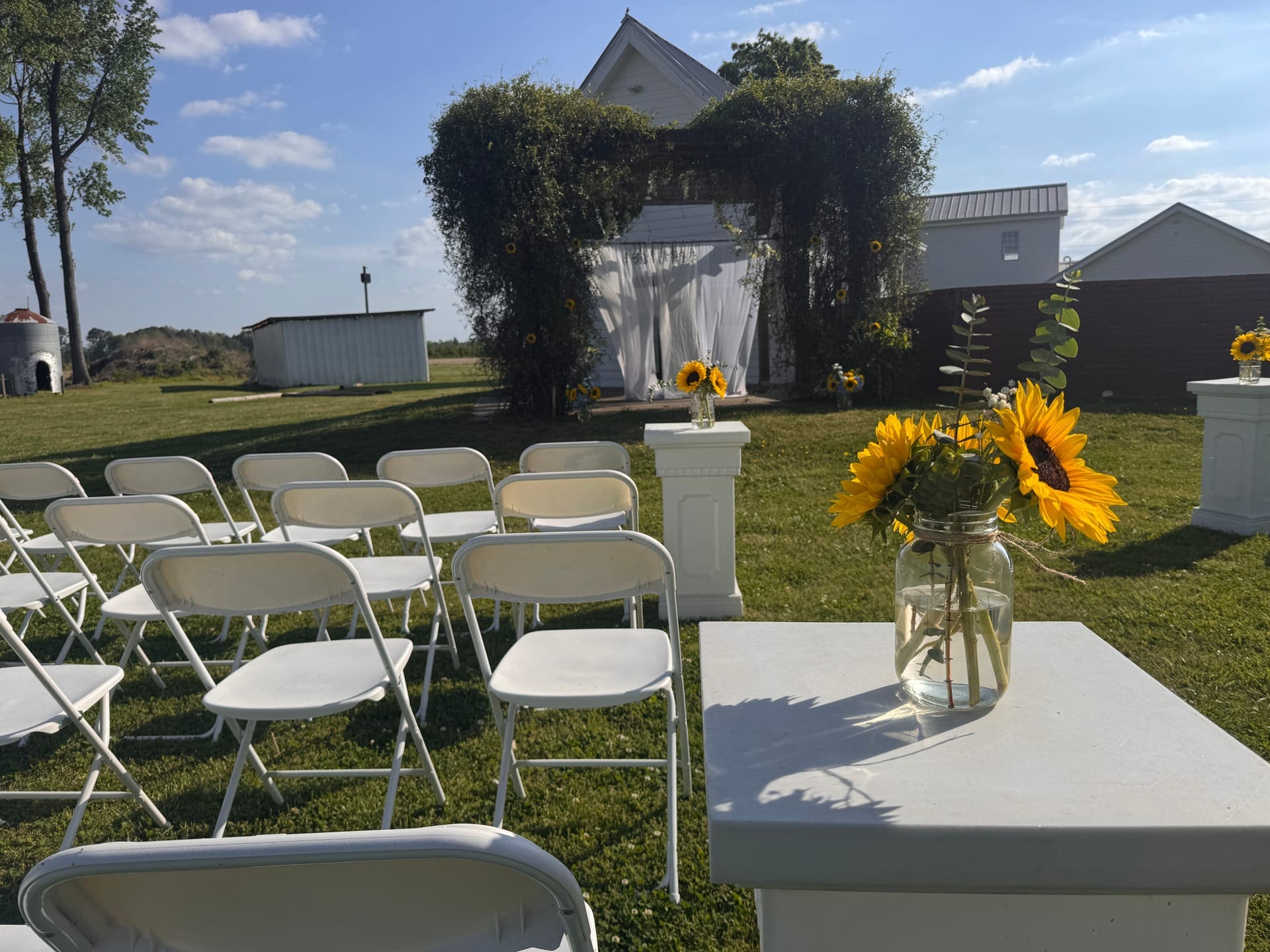 Sunflower-lined wedding ceremony setup at Scarborough House