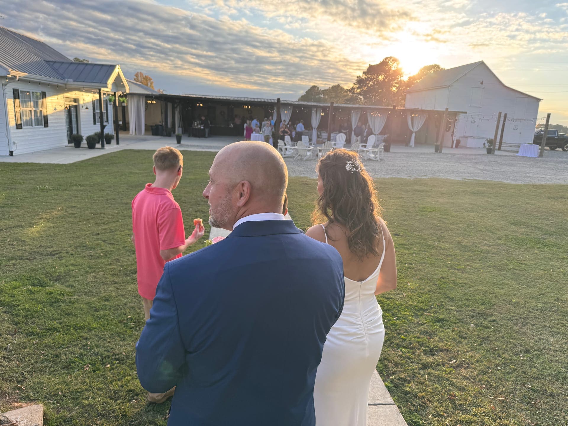 Couple at golden hour with string lights at Scarborough House near Raleigh, NC