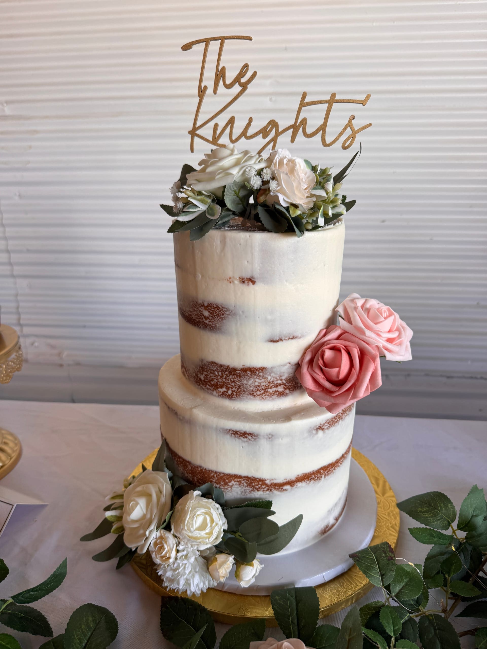 Naked wedding cake with pink roses at Scarborough House