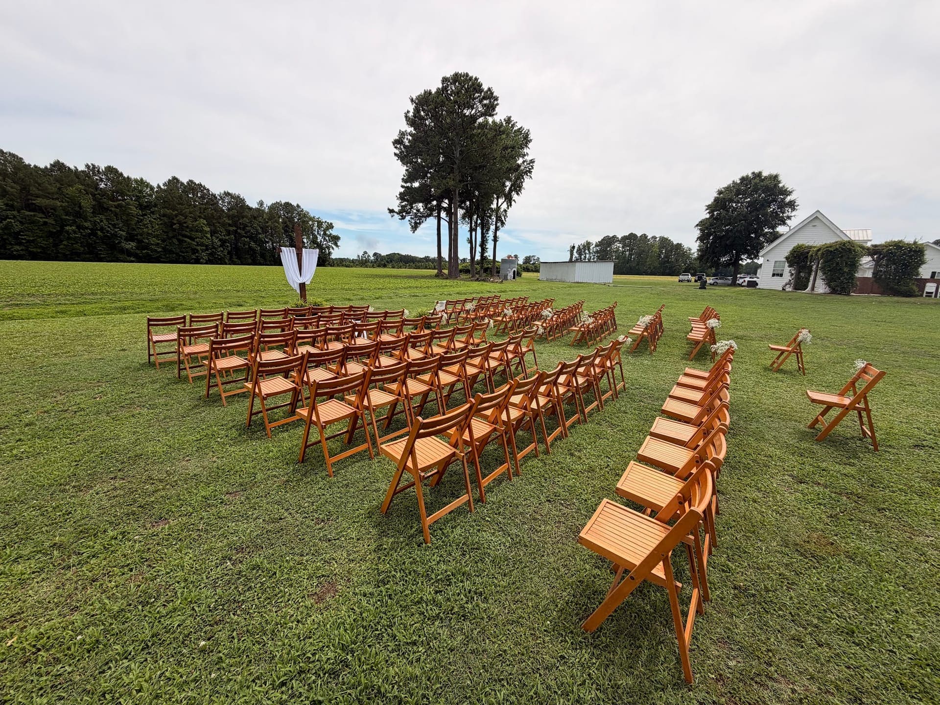 Outdoor wedding ceremony seating on the lawn at Scarborough House in Wilson County, NC